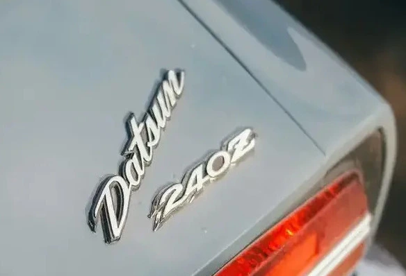 Rear detail of a classic Datsun 240Z showing the Datsun badge