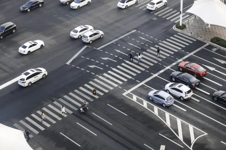 Cars at marked pedestrian crossing
