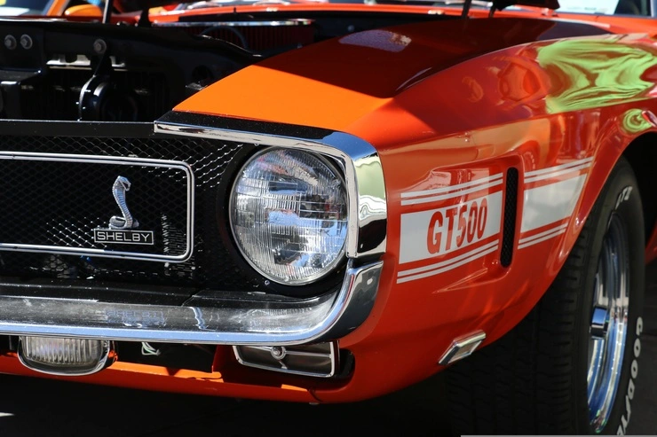 Fifth-generation Ford Mustang coupe featuring retro-inspired styling and a long grille.