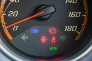 Car dashboard showing illuminated warning lights