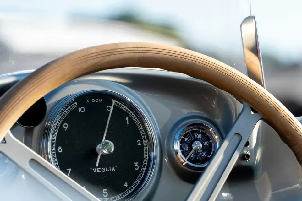 Traditional analogue speedometer and rev counter in a car dashboard