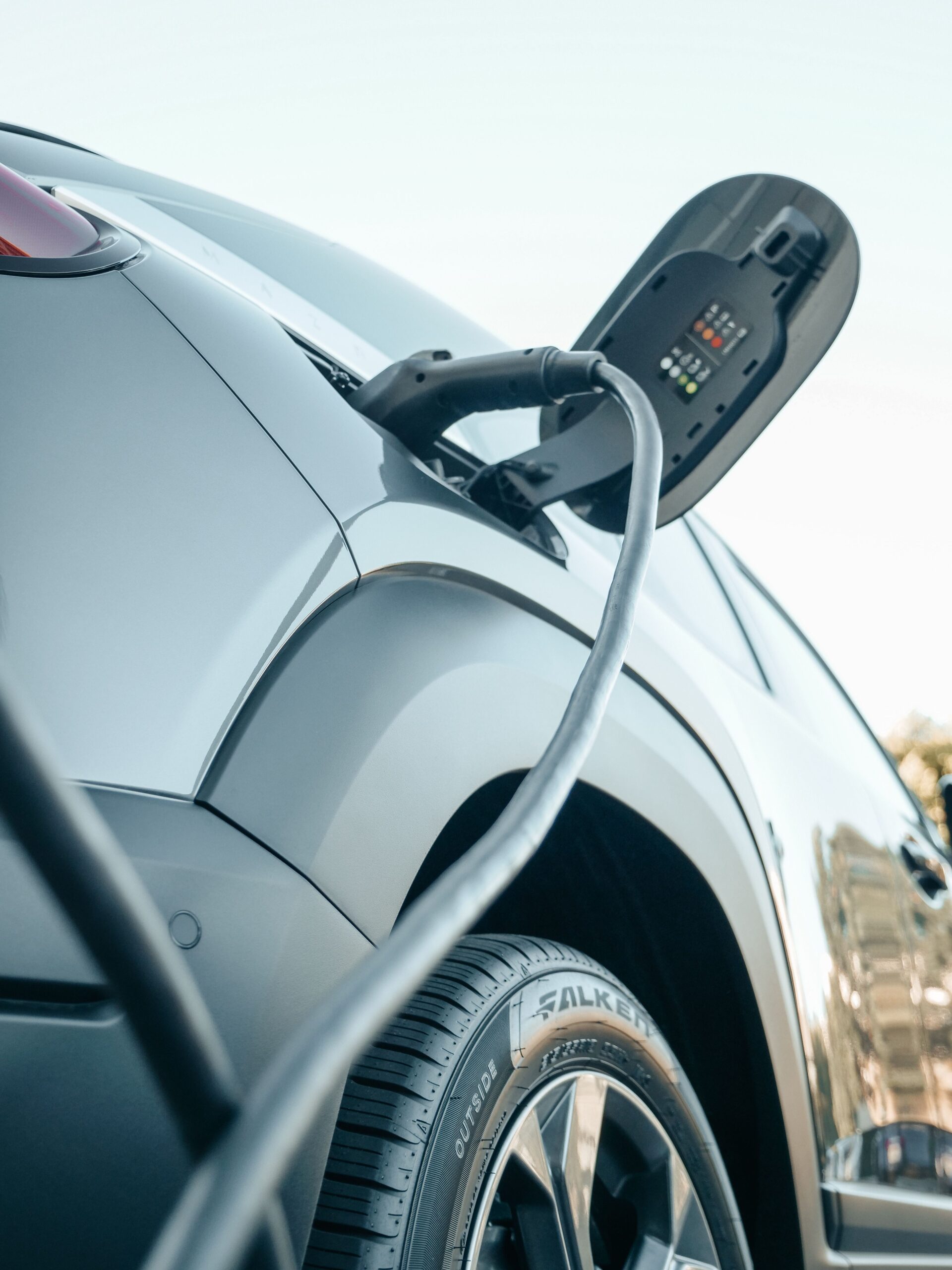 Plug-in hybrid car connected to a charging station